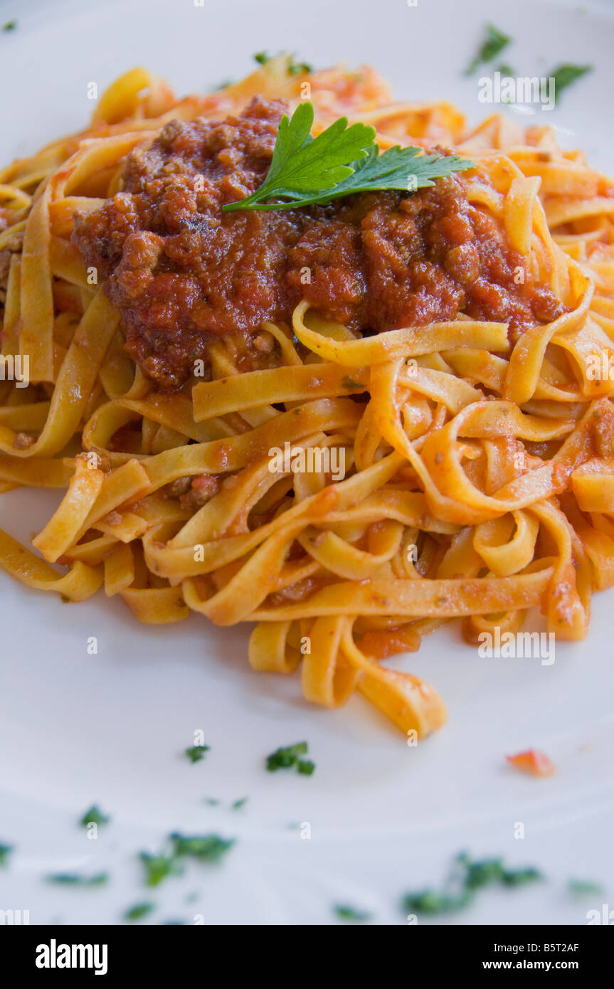 Fettuccine pasta with red meat sauce Stock Photo Alamy