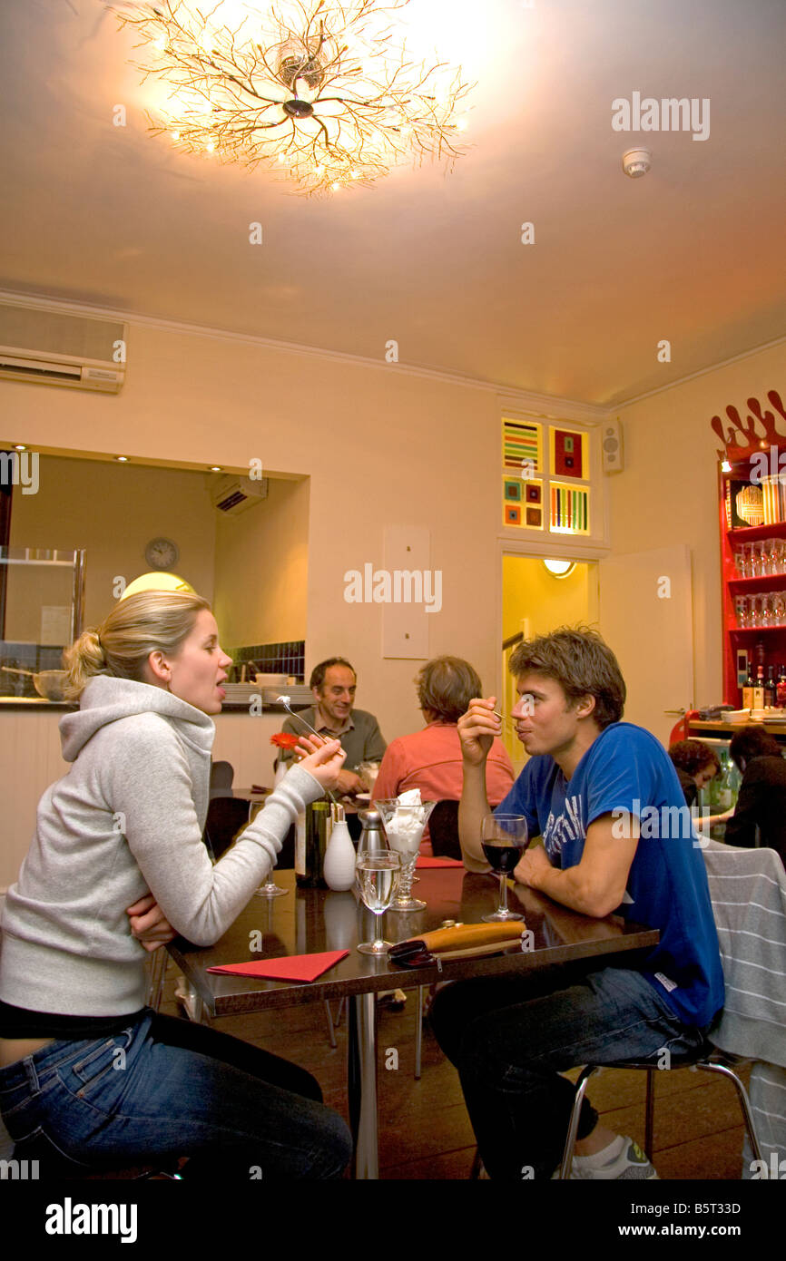 A couple eating ice cream at a cafe in the city of Bath Somerset