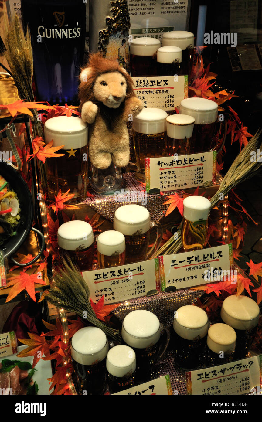 Plastic food pint glasses of beers in a Japanese restaurant window
