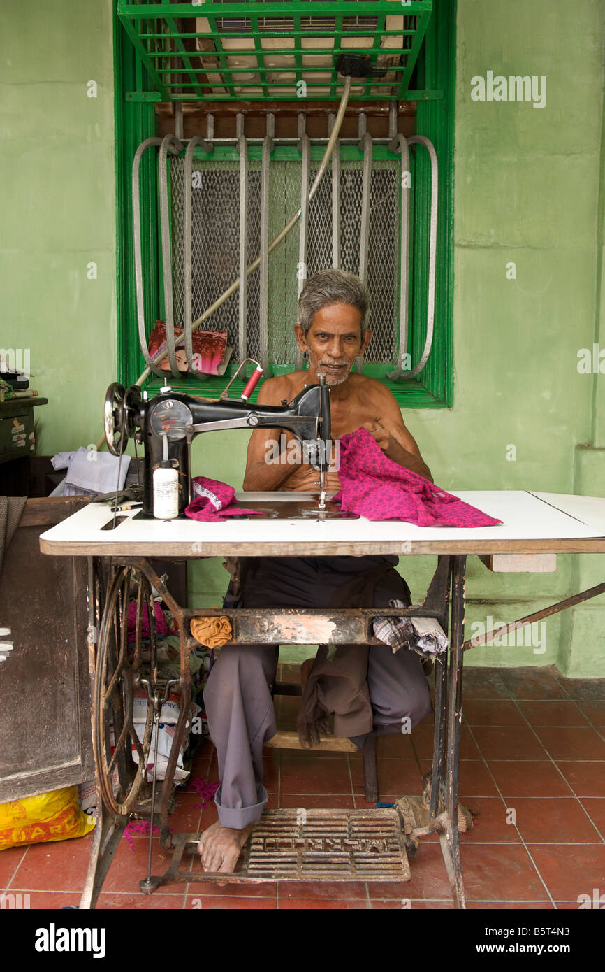 Man with a sewing machine in Pondicherry India Stock Photo