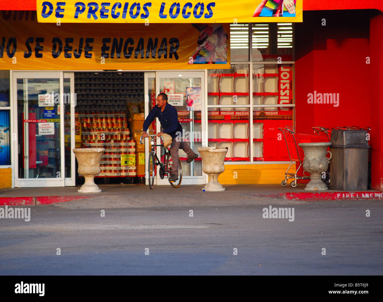 Mexican man getting on his bicycle Stock Photo
