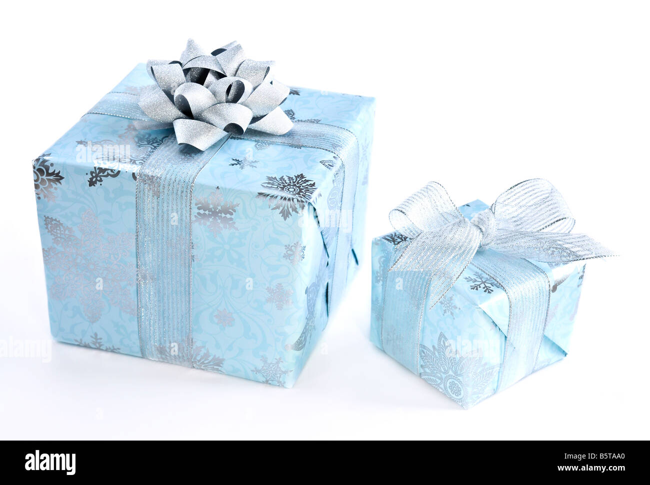 Two wrapped christmas gift boxes isolated on white background Stock