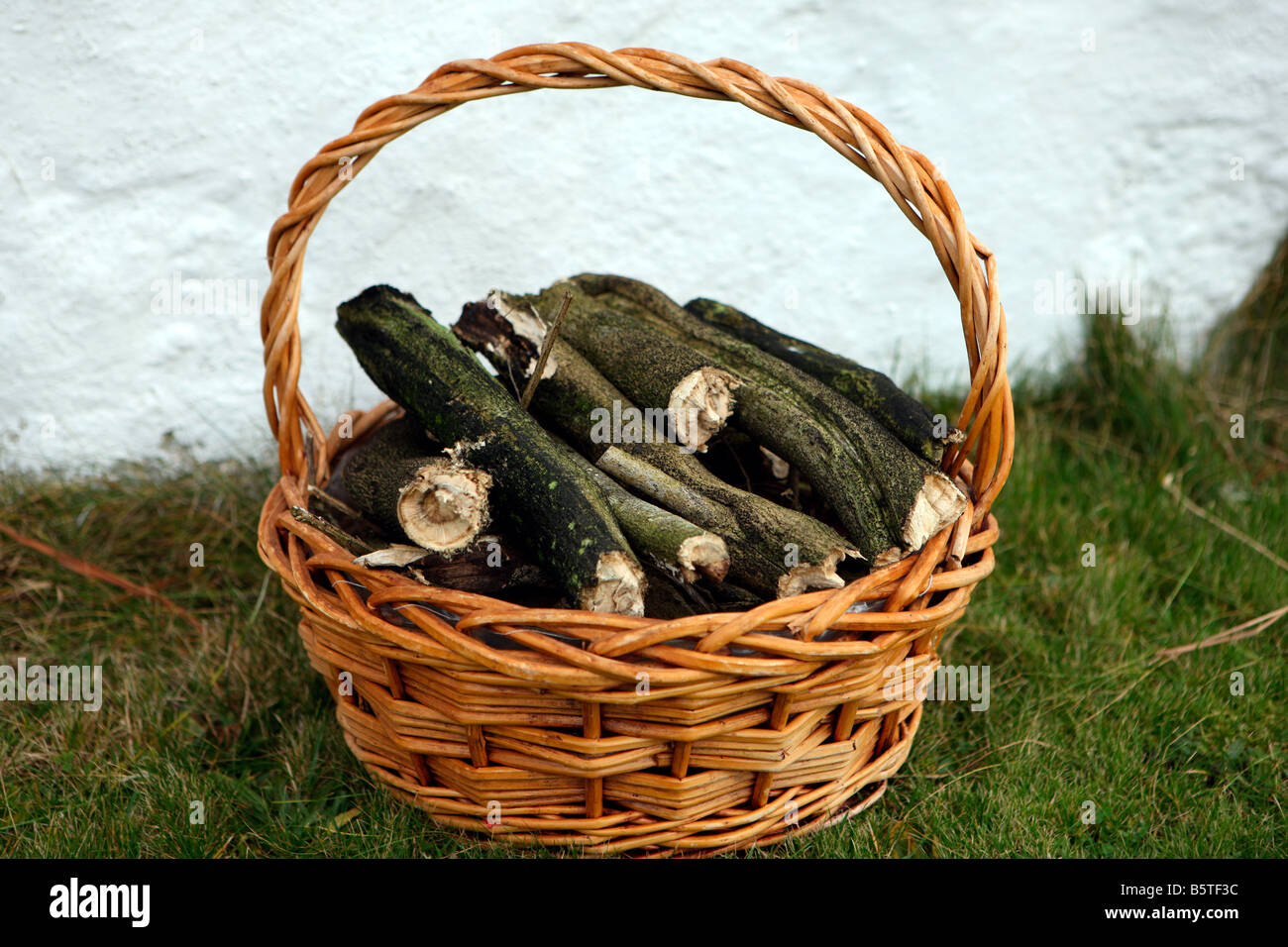 Basket of firewood Stock Photo Alamy
