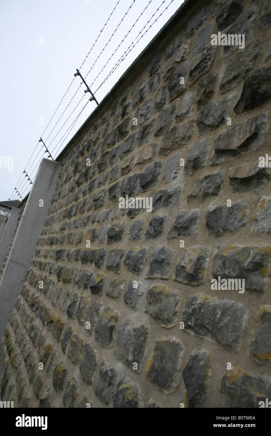 prison wall barbed wire maximum security fence Stock Photo - Alamy
