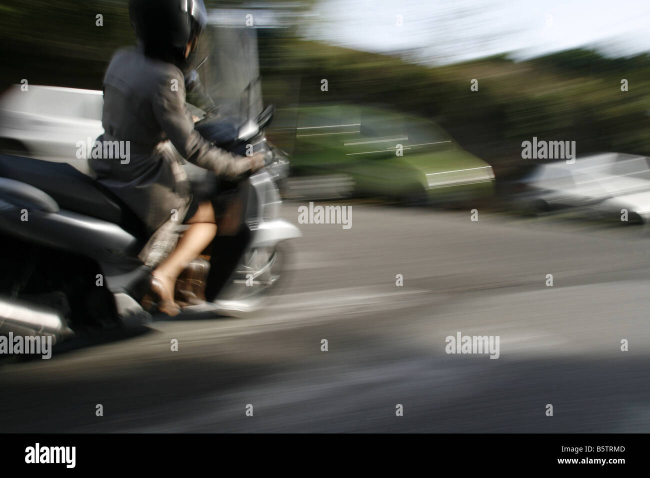 person riding scooter moped in rome italy Stock Photo Alamy