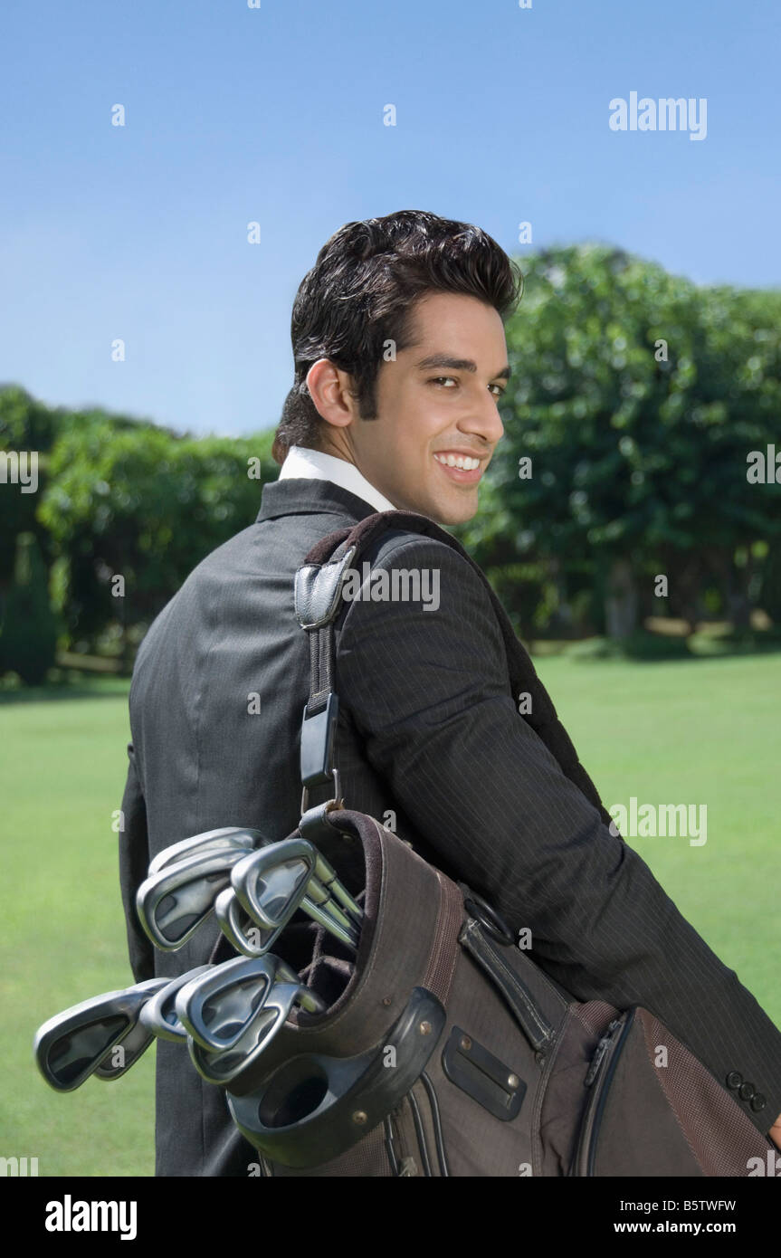 Businessman Carrying A Golf Bag Stock Photo Alamy businessman-carrying-a-golf-bag-stock-photo-alamy