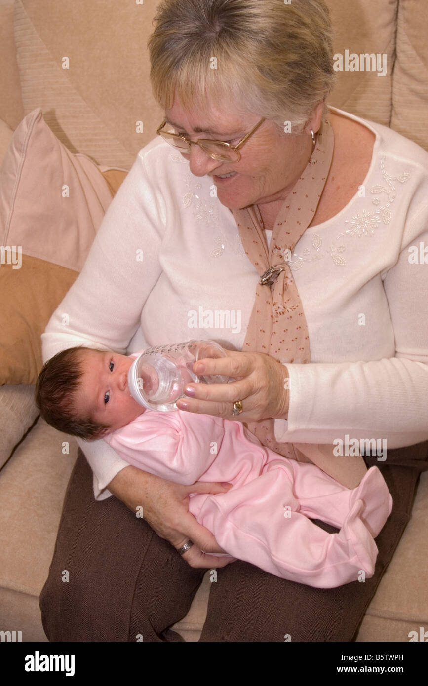 Grandmother Person Woman Bottle Feeding New Born 1 Week Old Baby Grand Daughter Stock Photo Alamy