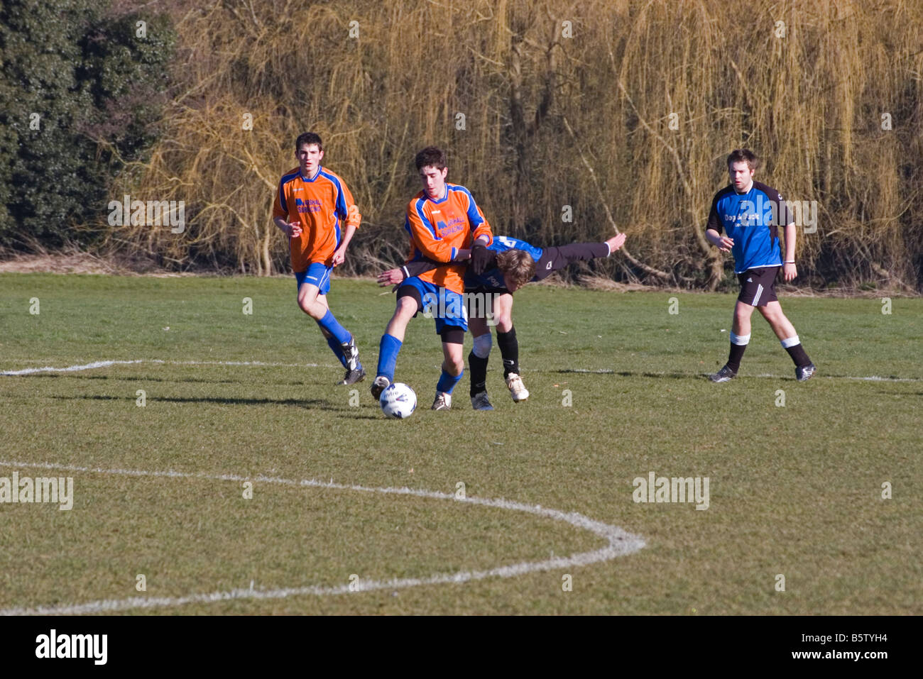 Amateur 'sunday league' association Football Match Two Players Tussling for the Ball Stock Photo