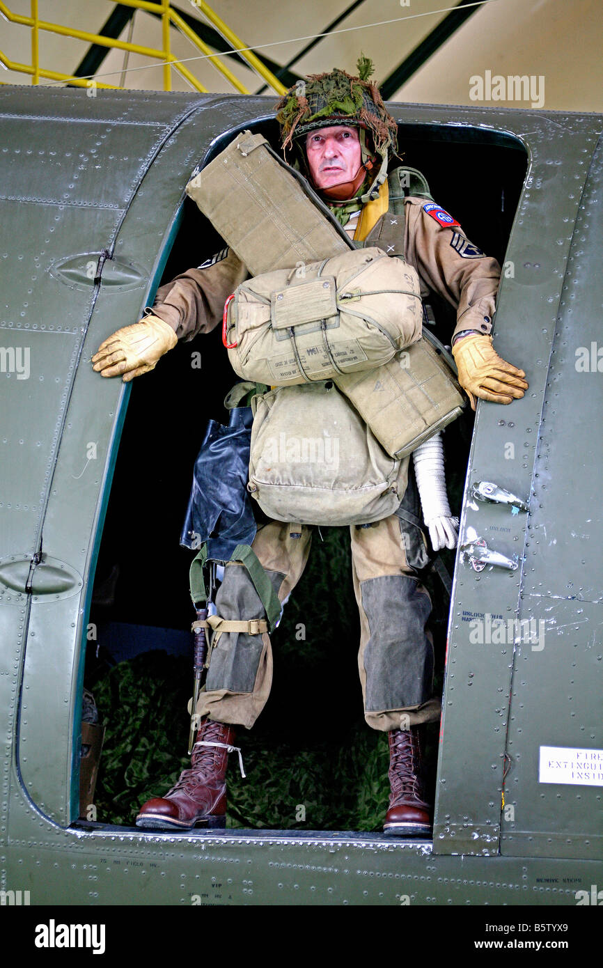 an actor dressed as a D Day  U.S. 101st airborne paratrooper in the doorway of C47 Dakota aircraft,Normandy,France. Stock Photo