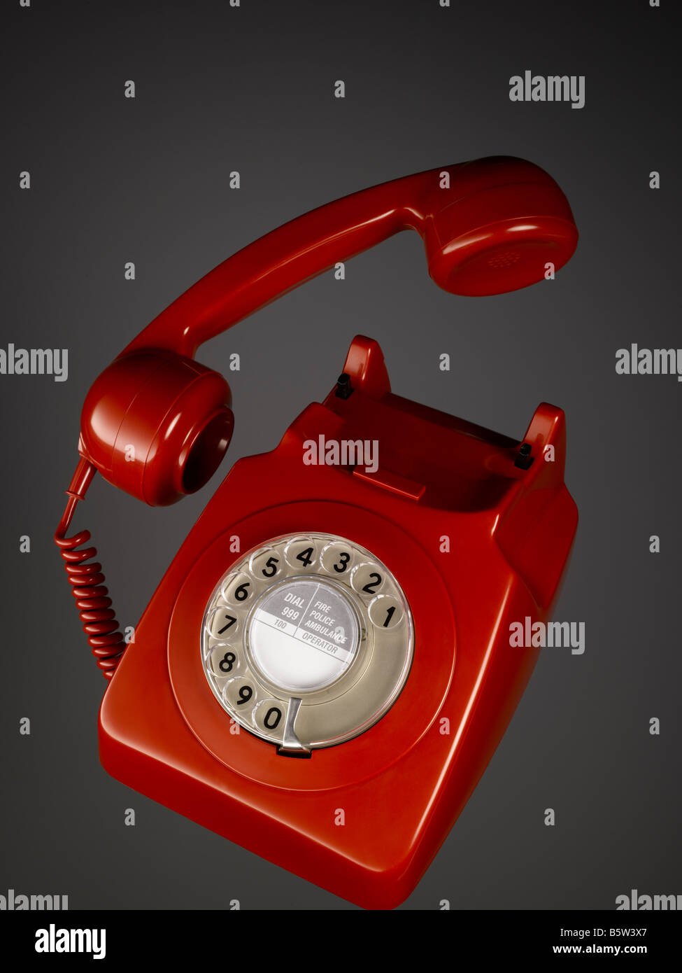 A classic red bakelite telephone Stock Photo