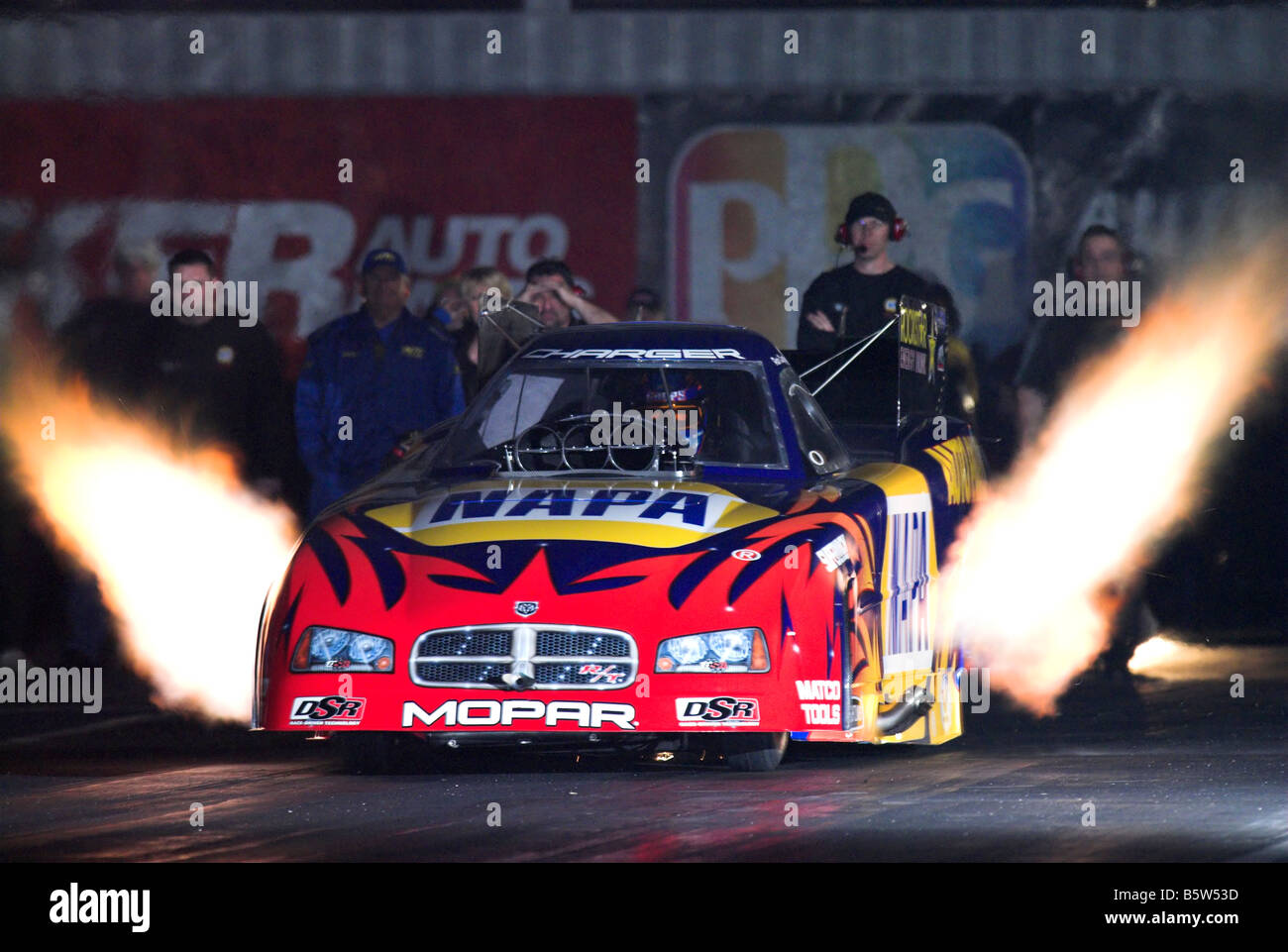 The "NAPA" NHRA funny car of Ron Capps accelerates off the line (nighttime) at Firebird Int'l. Raceway, Phoenix, Arizona, USA Stock Photo