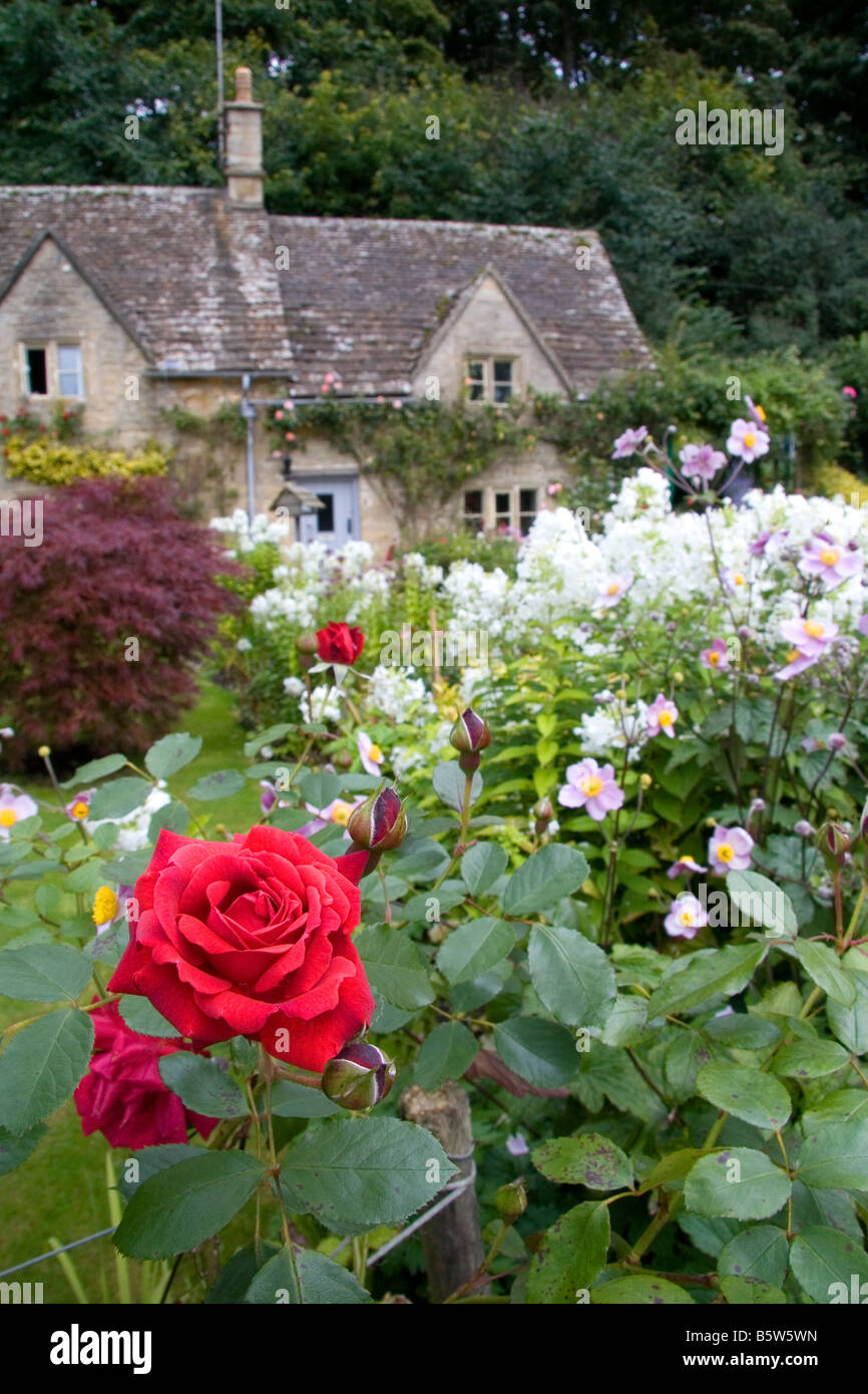 Cotswold stone cottage and garden in the village of Bibury Gloucestershire England Stock Photo