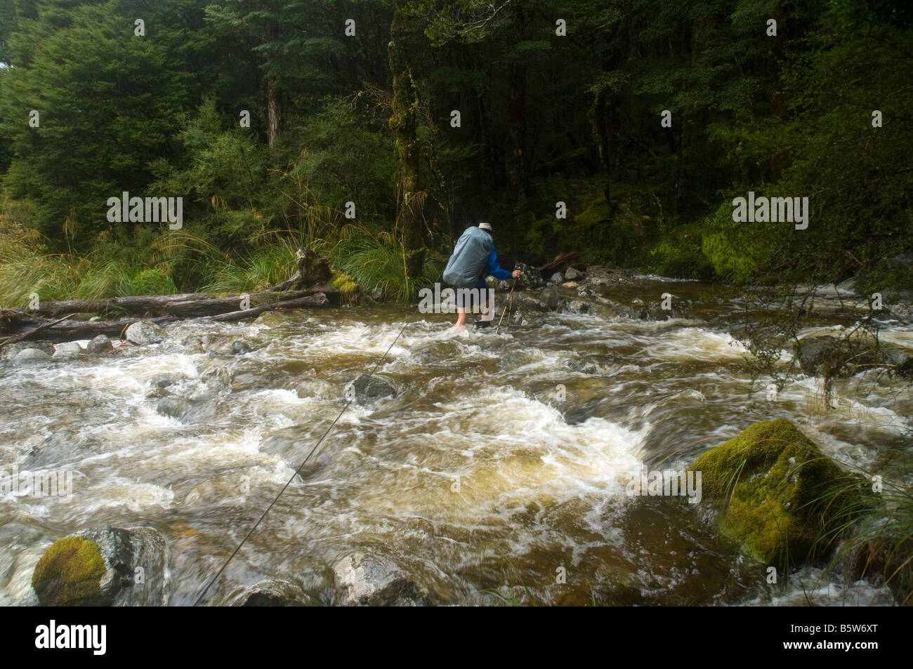 Using a single wire for safety while crossing a flooded stream ...