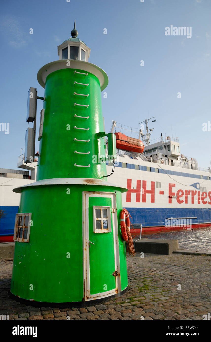 Green lighthouse and ferry at the harbour of Helsingor Denmark May 2007 Stock Photo