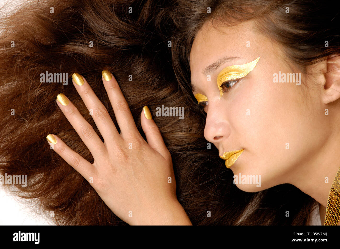 Woman with golden makeup Stock Photo