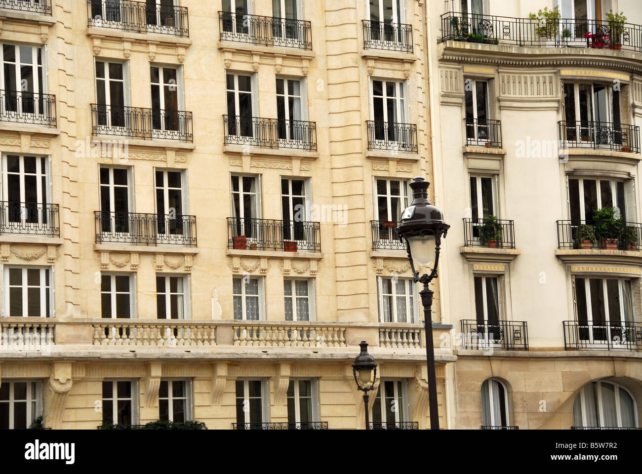 Windows and balconies of old apartment buildings in Paris France Stock Photo