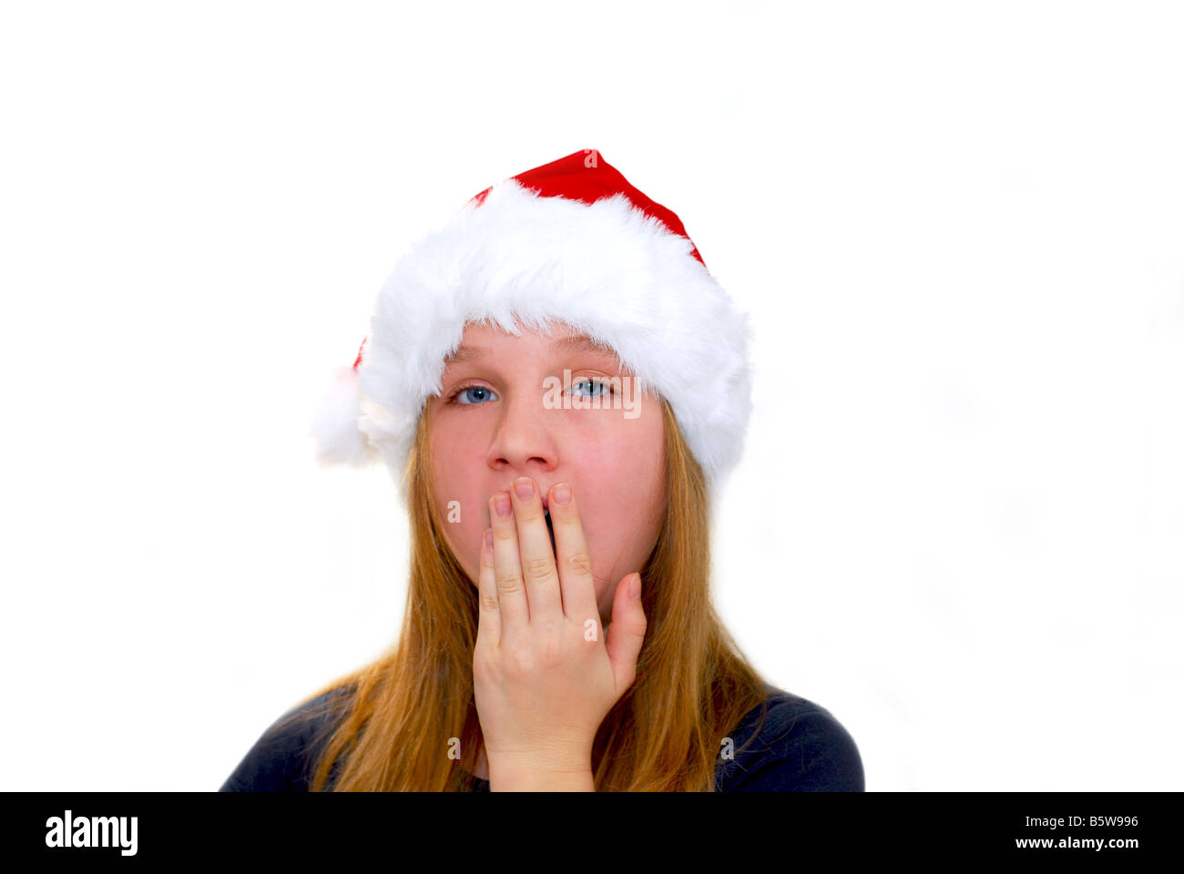 Portrait of a young girl wearing Santa s hat isolated on white background Stock Photo
