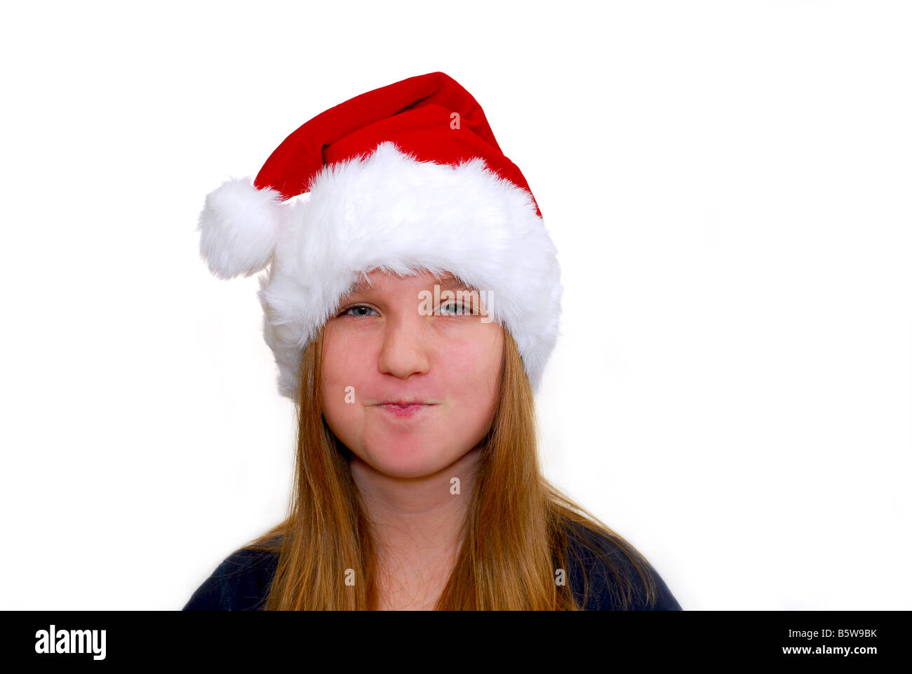 Portrait of a young girl wearing Santa s hat isolated on white background Stock Photo