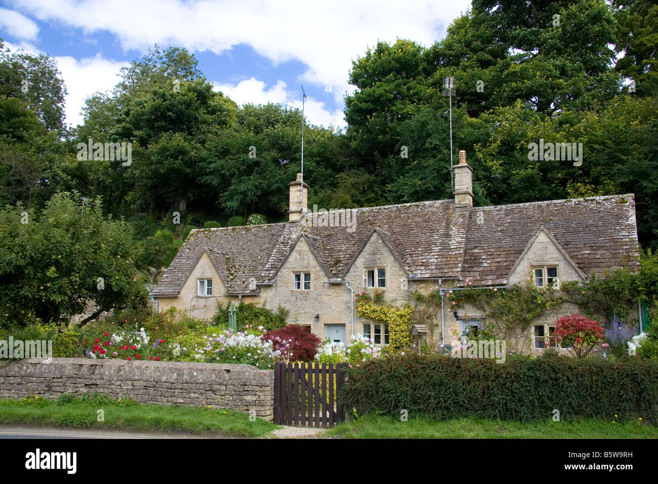 Cotswold stone cottage in the village of Bibury Gloucestershire England Stock Photo