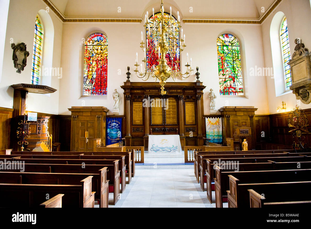 Interior of Church of St Michael Paternoster Royal , Seafarers Mission , City of London , with modern stained glass windows Stock Photo