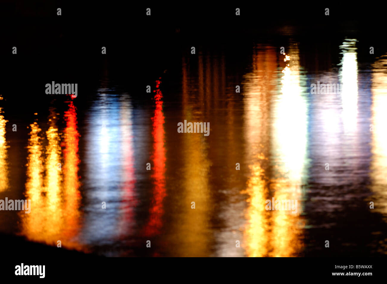 Colorful streetlights reflecting in water Stock Photo