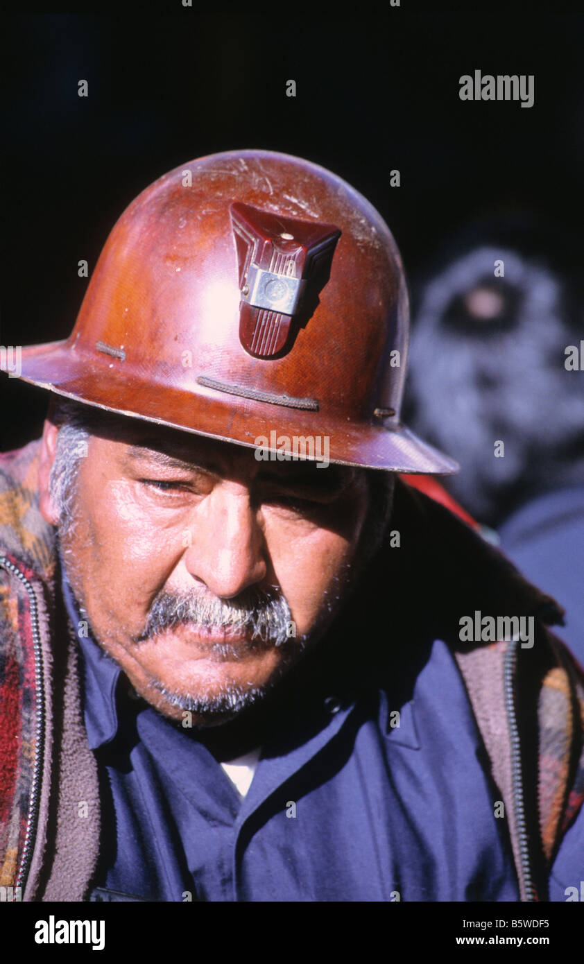 Head and shoulders portrait of a middle aged miner wearing a helmet, Bolivia Stock Photo