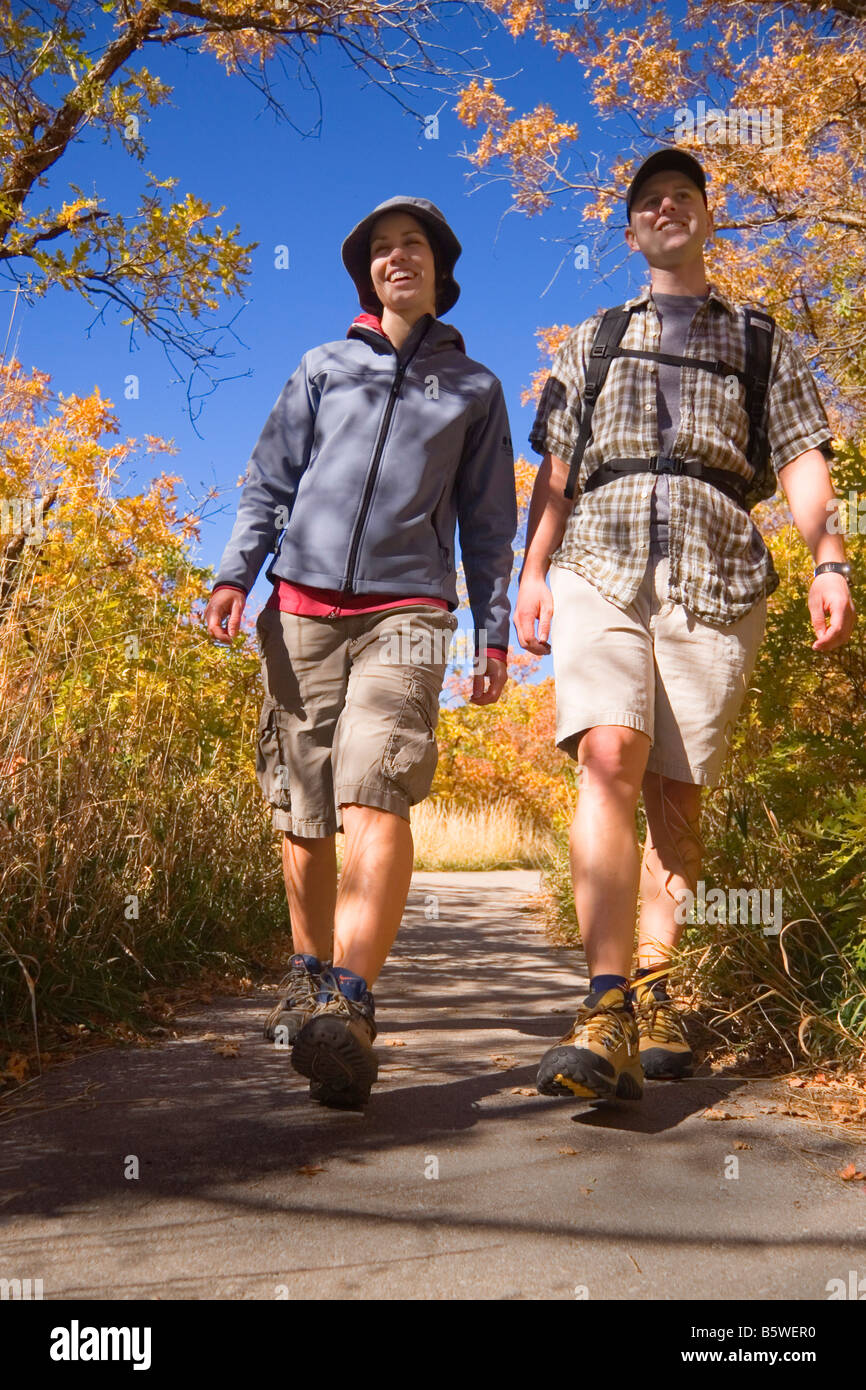 Young couple hiking amid the autumn colors on the Temple Quarry Trail