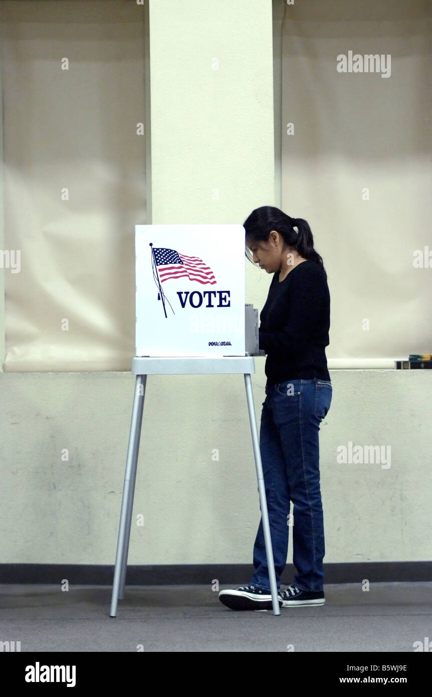 24 year-old Hispanic woman marking her ballot in San Jose, CA, on November 4, during the 2008 U.S. Presidential election. Stock Photo