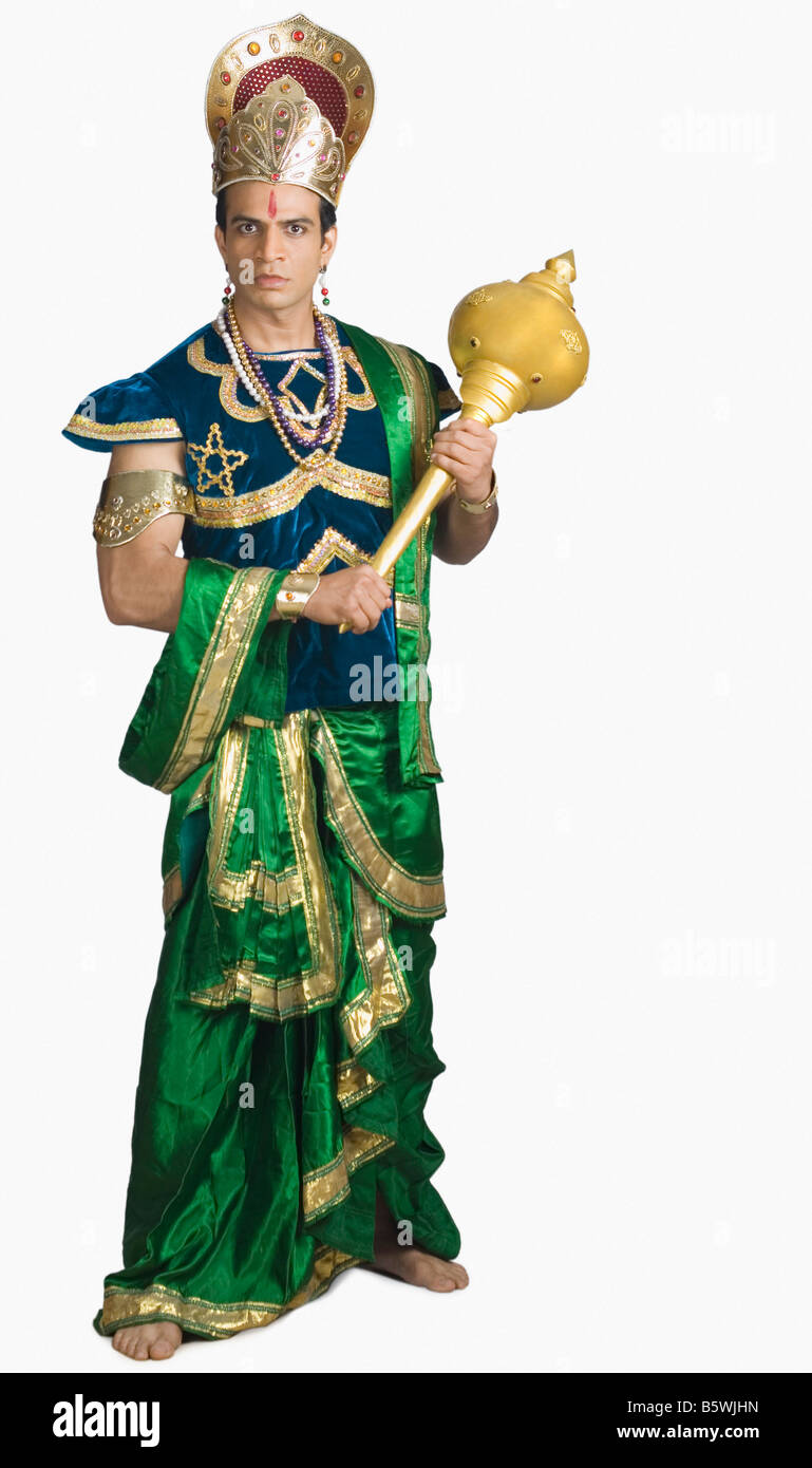 Young man dressed-up as Bhima holding a mace Stock Photo