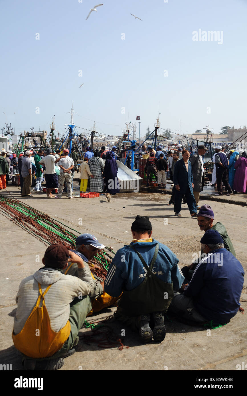 Fishermen resting in the Scala du Port at Essaouira Morocco Stock Photo