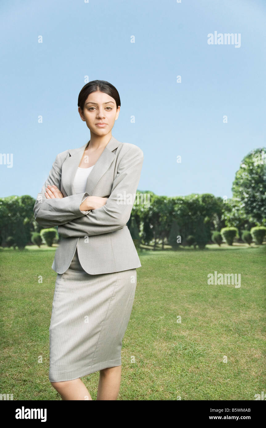 Businesswoman standing with her arms crossed Stock Photo
