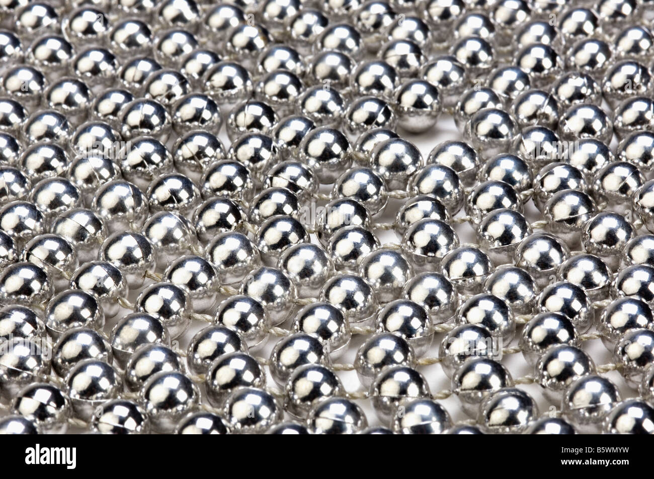 Silver string beads hi-res stock photography and images - Alamy