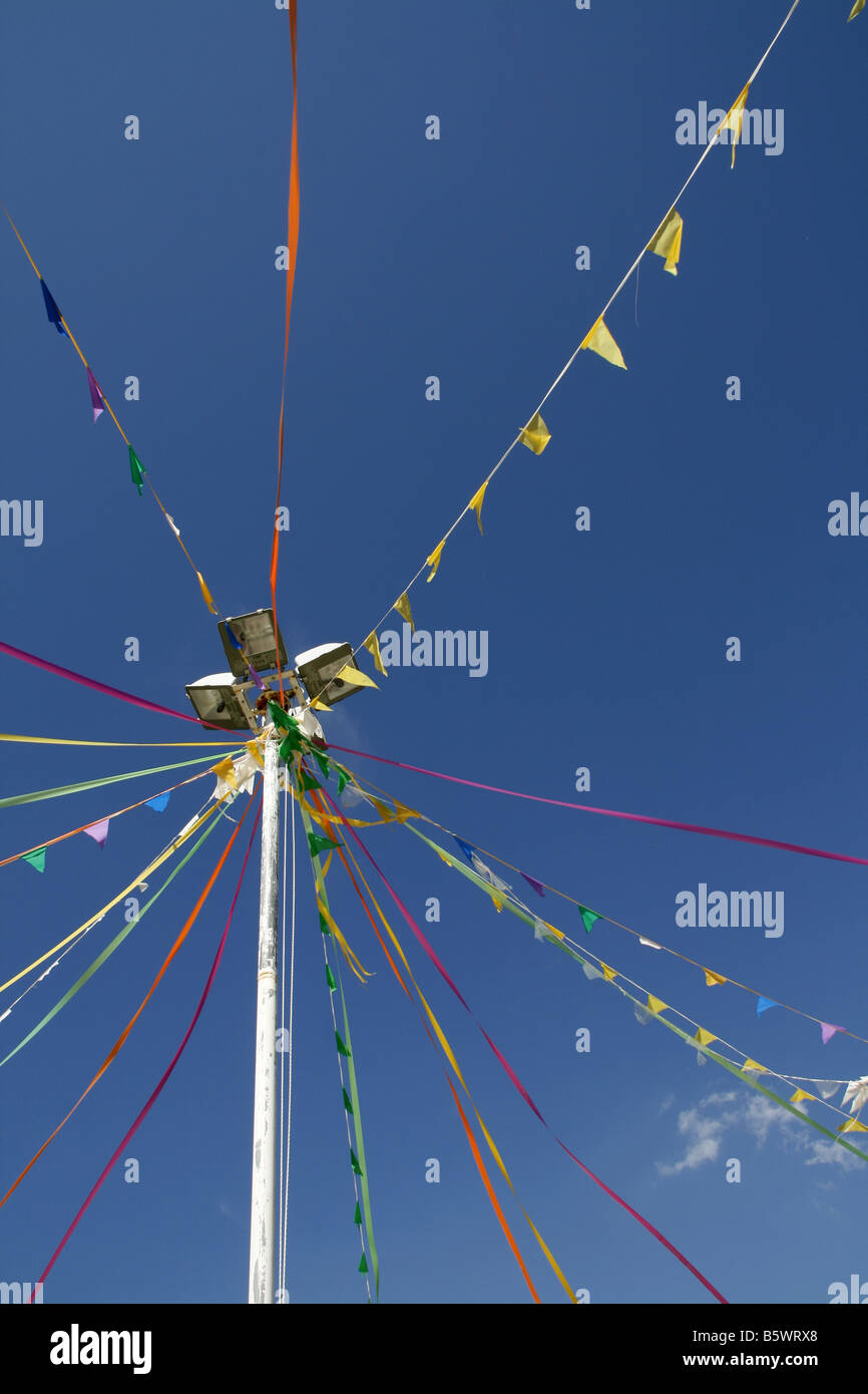many colourful carnival flags decorations in street party outdoors in