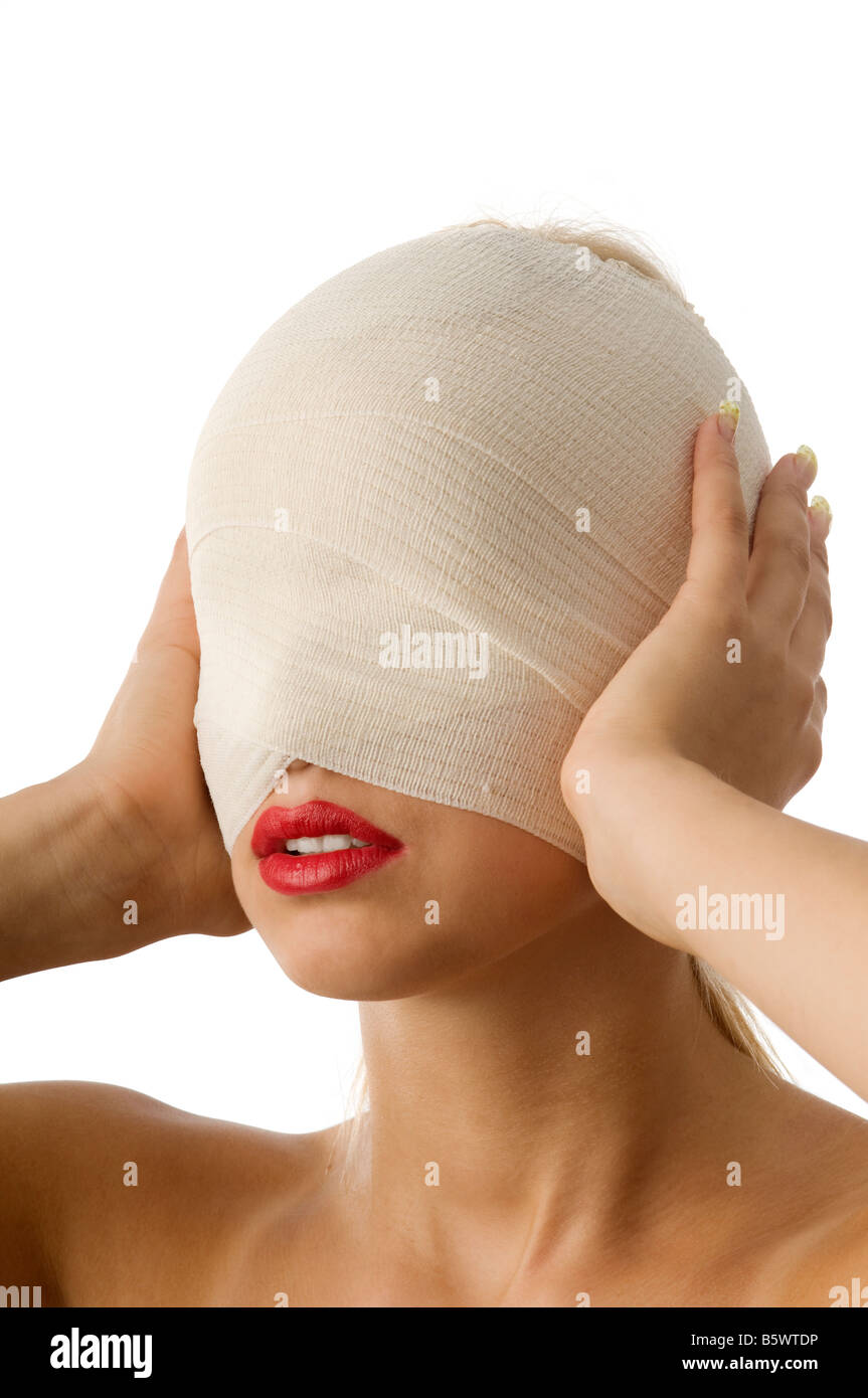 portrait of woman with bandage with hands against ears Stock Photo Alamy