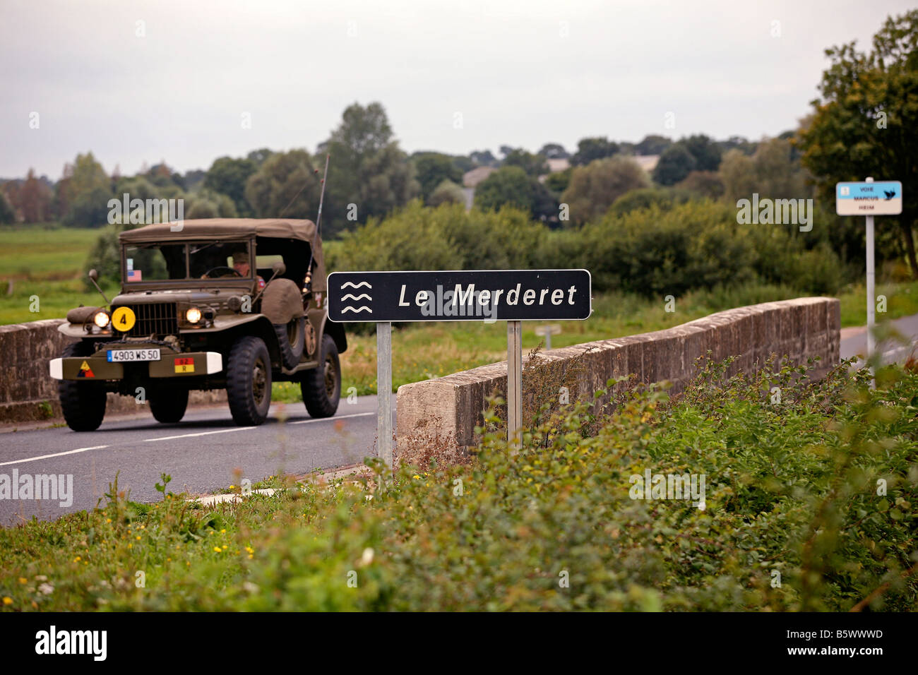 A D Day Dodge Command car on a bridge crossing the Merderet River near Ste Mere Eglise, Normandy,France Stock Photo