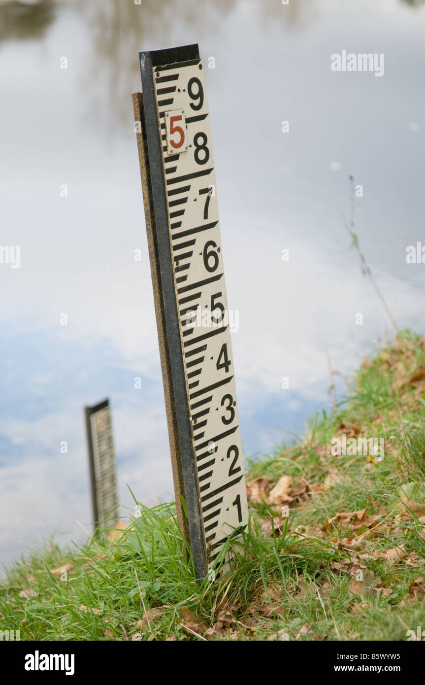 Flood level markers measuring the depth of the river on the River Wye Powys Wales autumn Stock Photo
