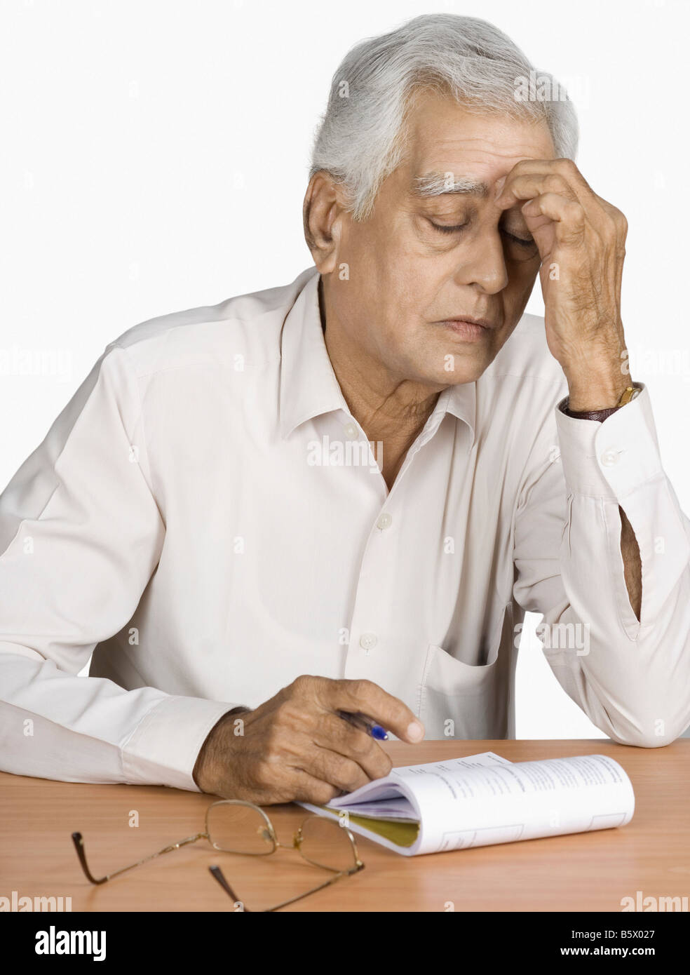 Indian man thinking holding pen hi-res stock photography and images - Alamy