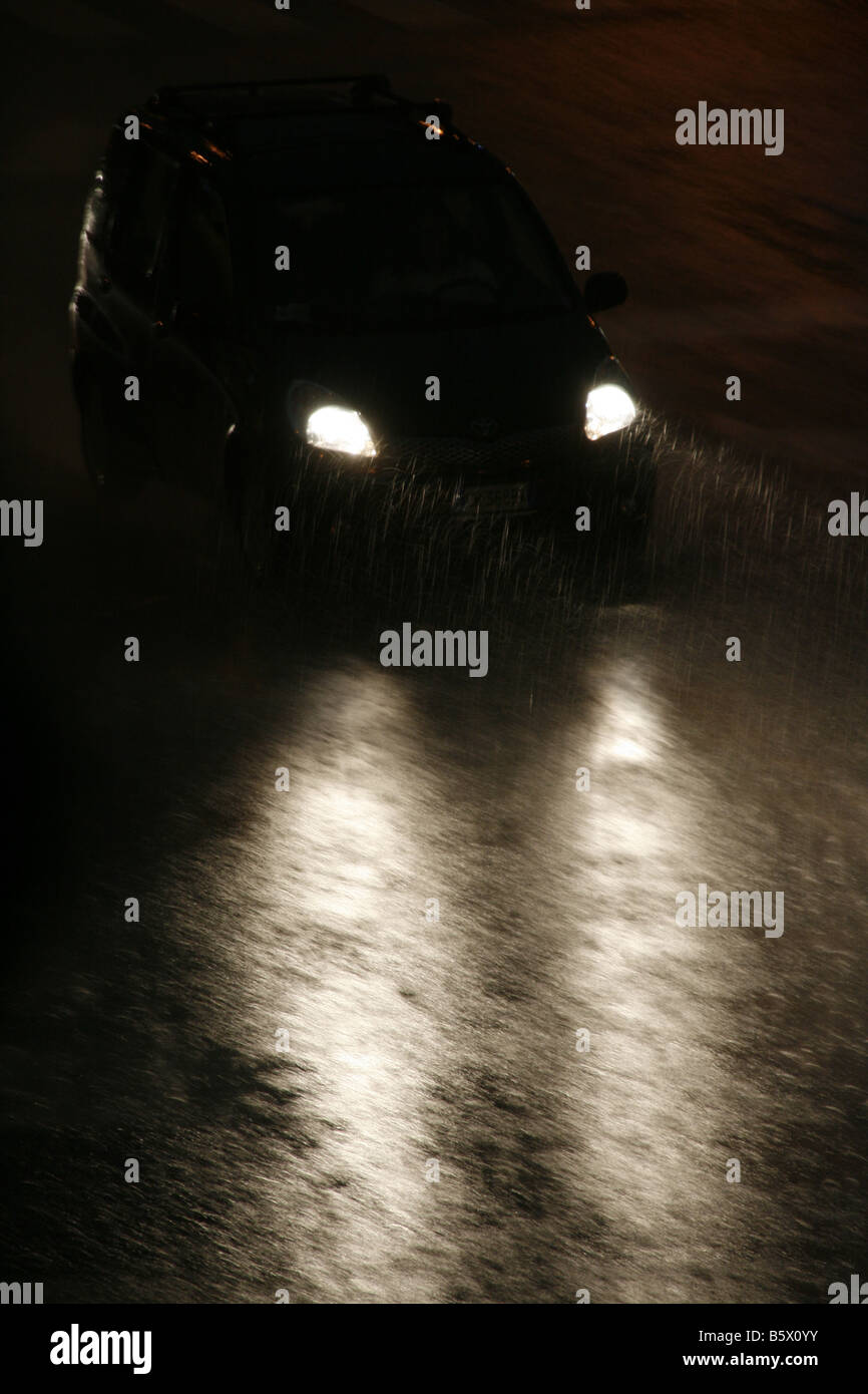 fast car driving in heavy rain at night in town Stock Photo Alamy