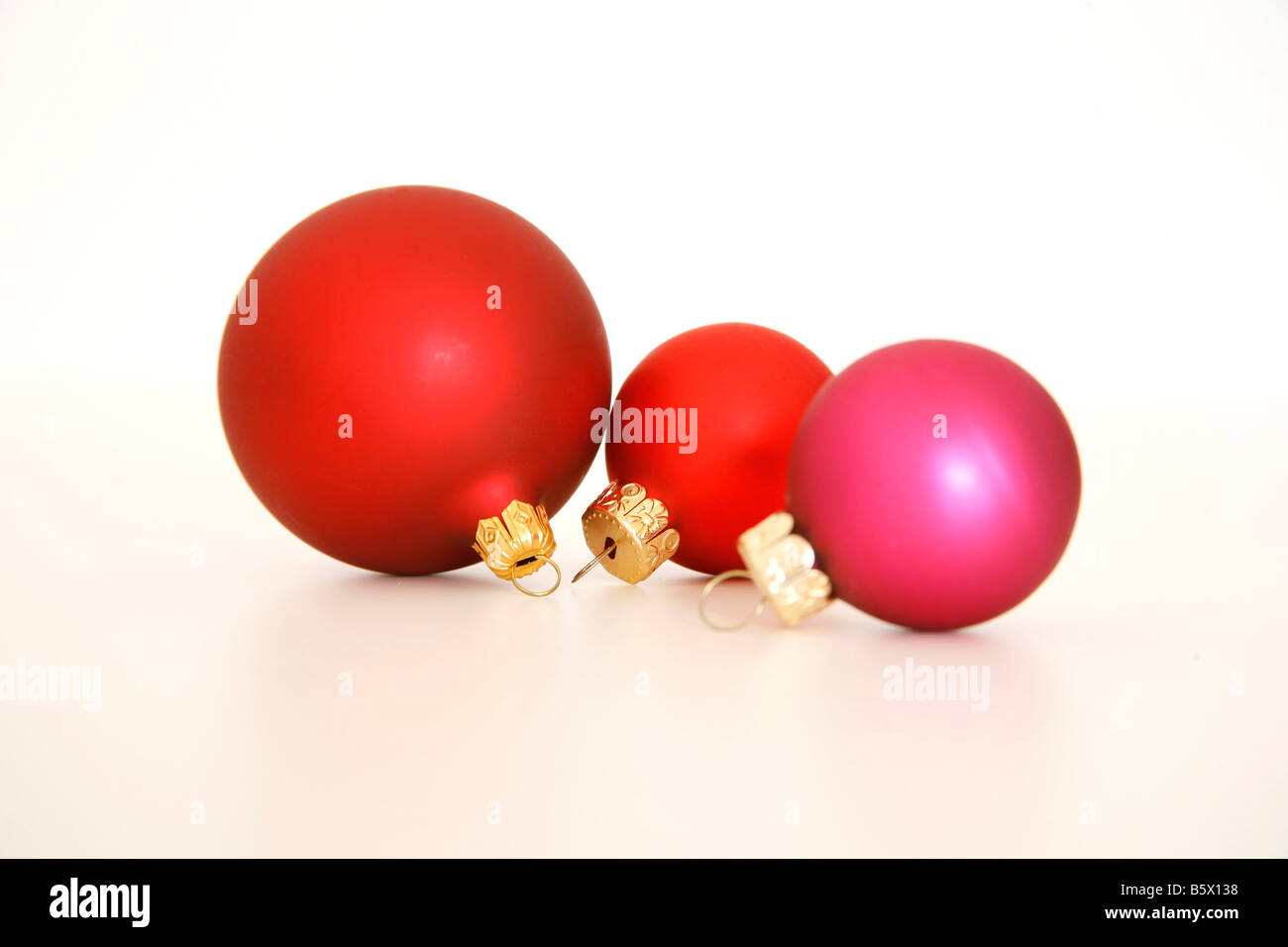 Three Christmas ball decorations with drop shadow Stock Photo