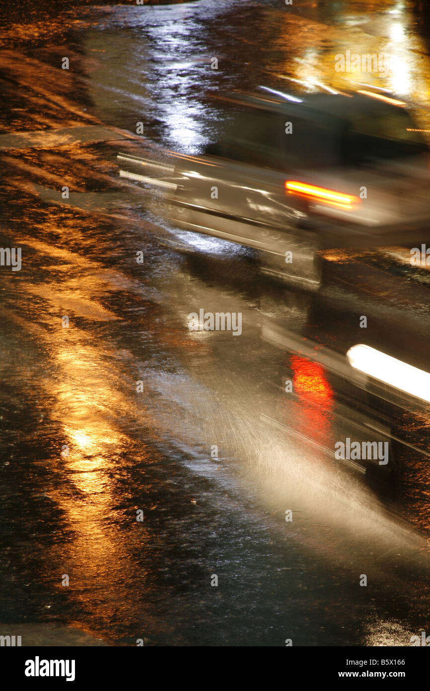 fast car driving in heavy rain at night in town Stock Photo - Alamy