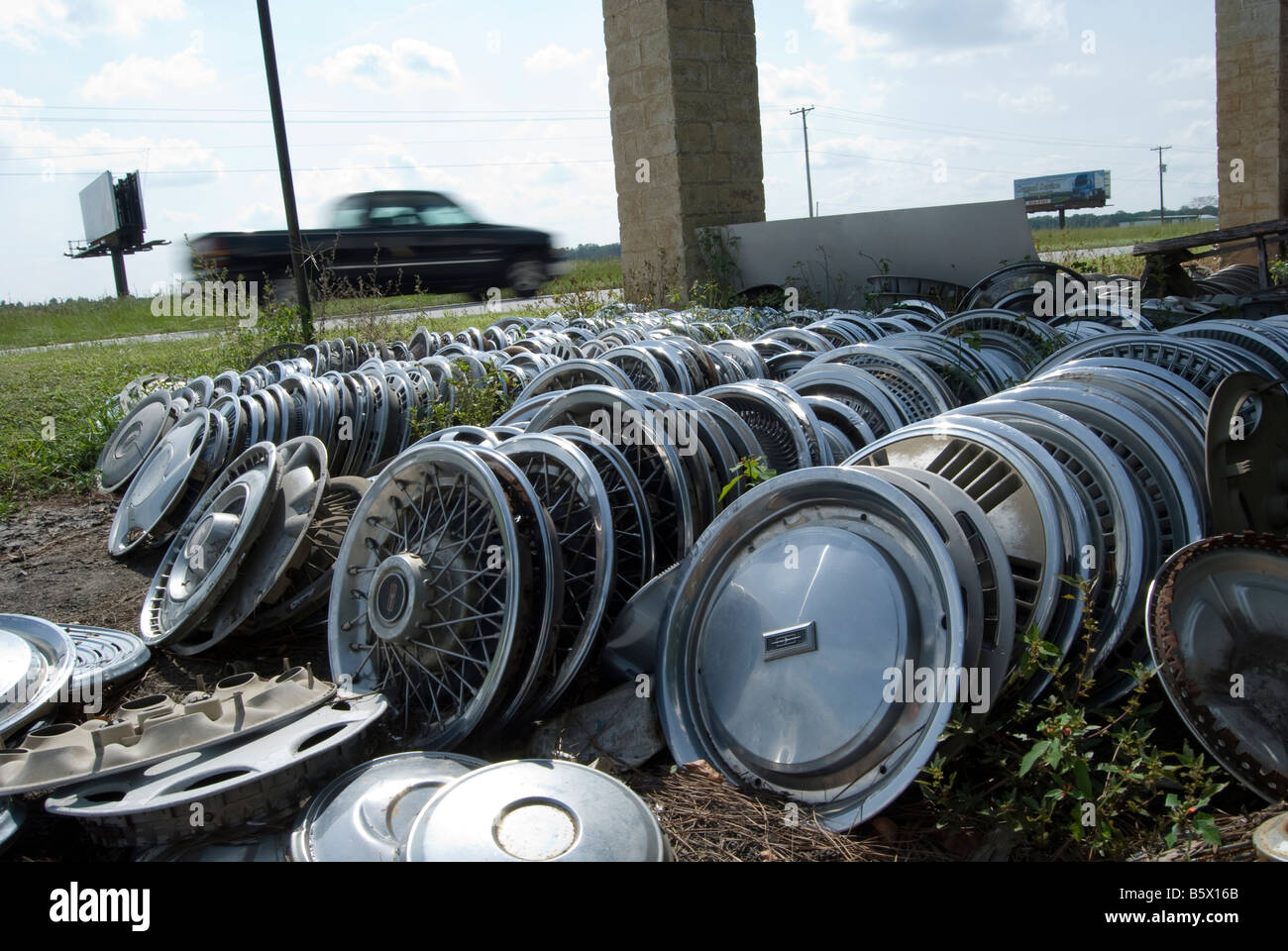 a pile of hub caps hubcaps at the side of the road 70 E in North