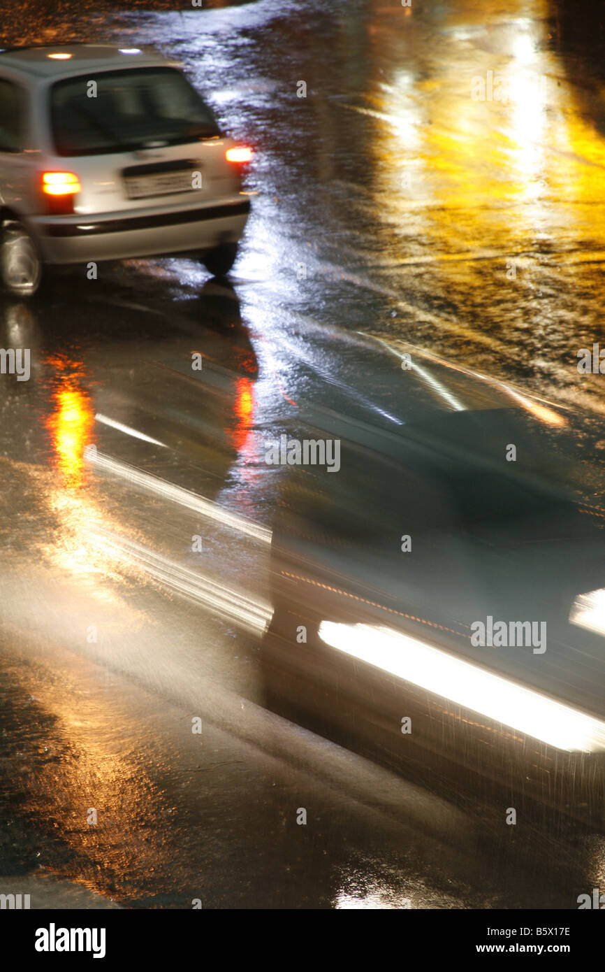 fast car driving in heavy rain at night in town Stock Photo Alamy