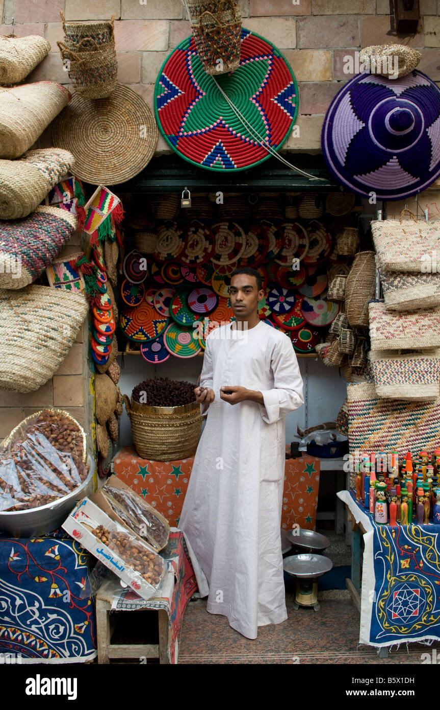 Shopkeeper wearing traditional galabiyeh garment in Khan el-Khalili a major souk in the historic center of Islamic Cairo Egypt Stock Photo