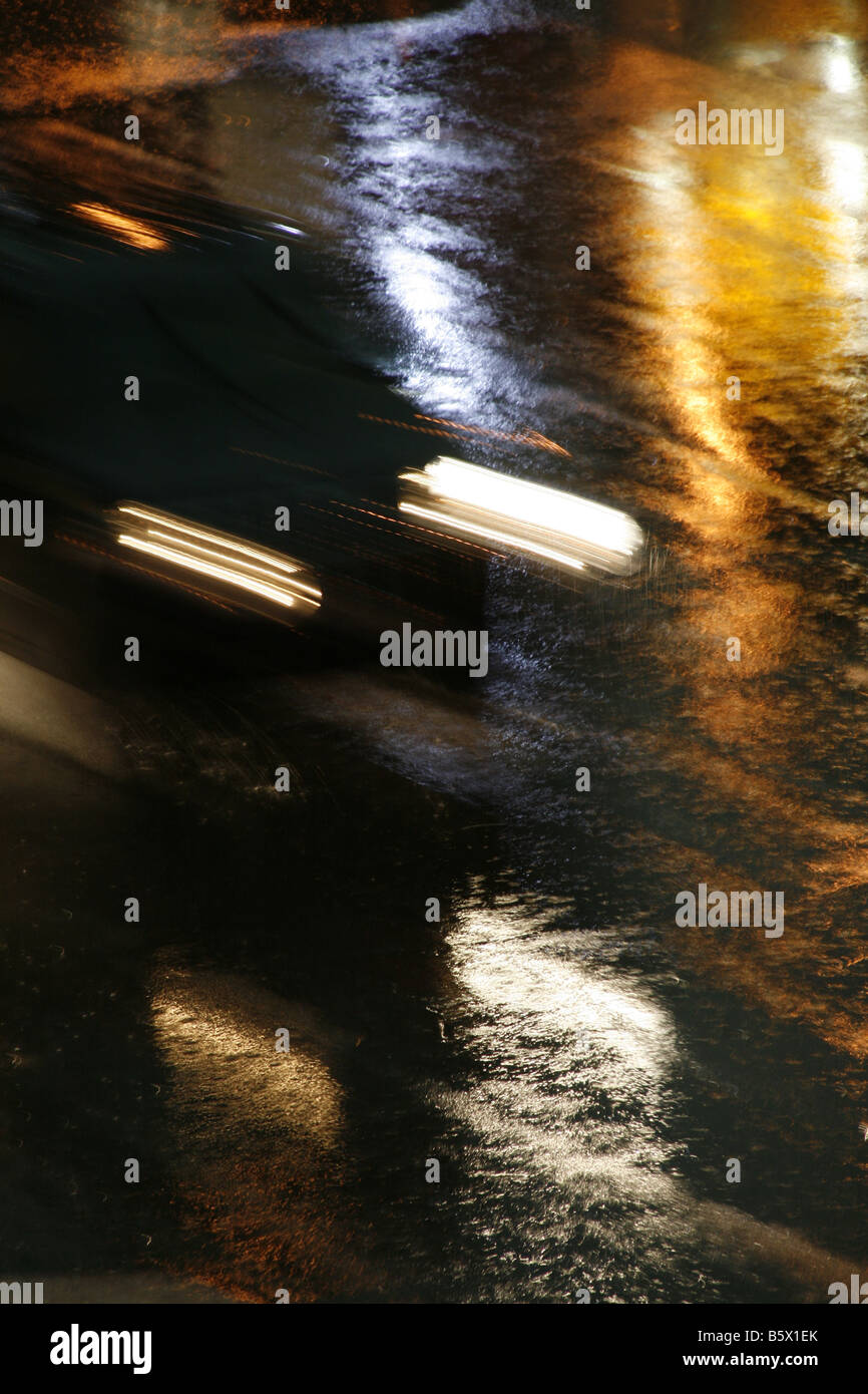 fast car driving in heavy rain at night in town Stock Photo Alamy