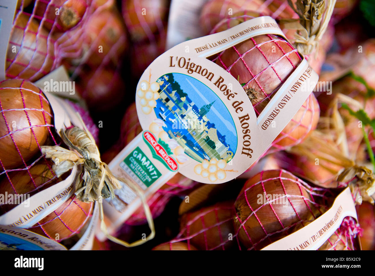 Borough Farmers Market , bags of L'Oignon Rose de Roscoff , Prince de Bretagne , beautiful sweet pink onions from Brittany Stock Photo