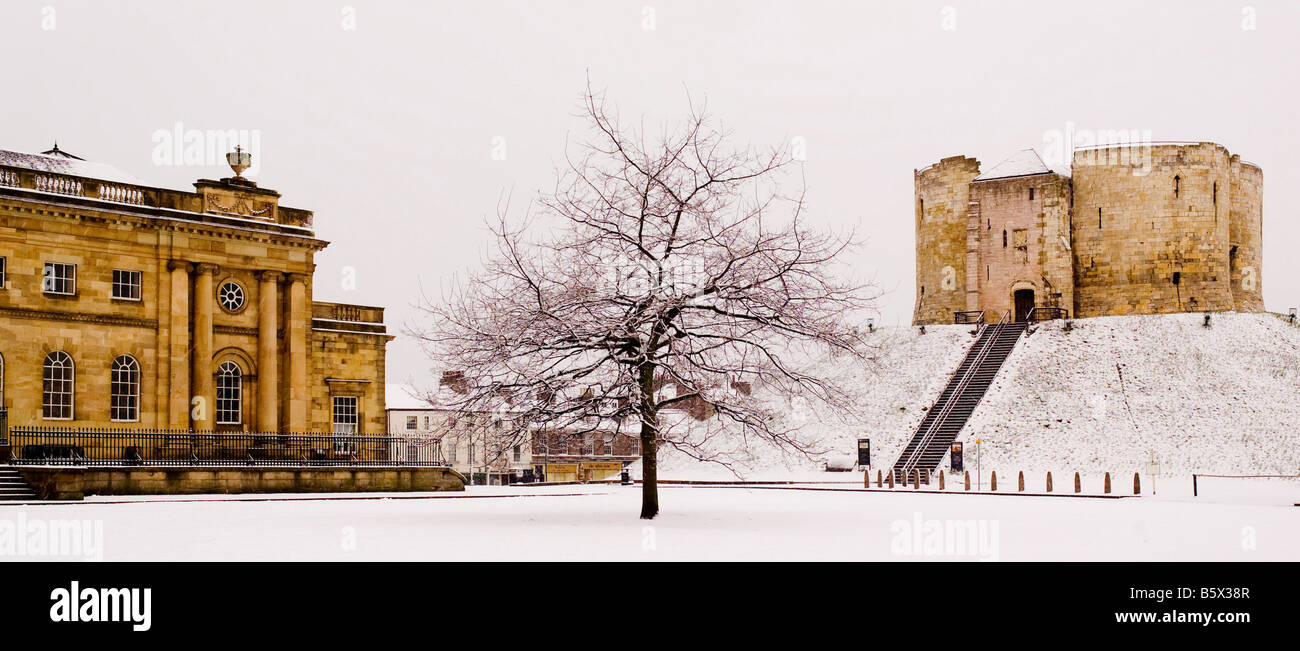 Clifford's Tower and York Crown Court in snow with the Eye of York oak tree in the foreground. UK Stock Photo