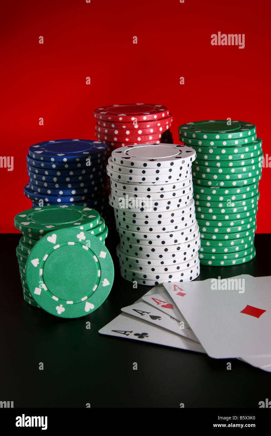 Piles of poker chips and playing cards Stock Photo Alamy