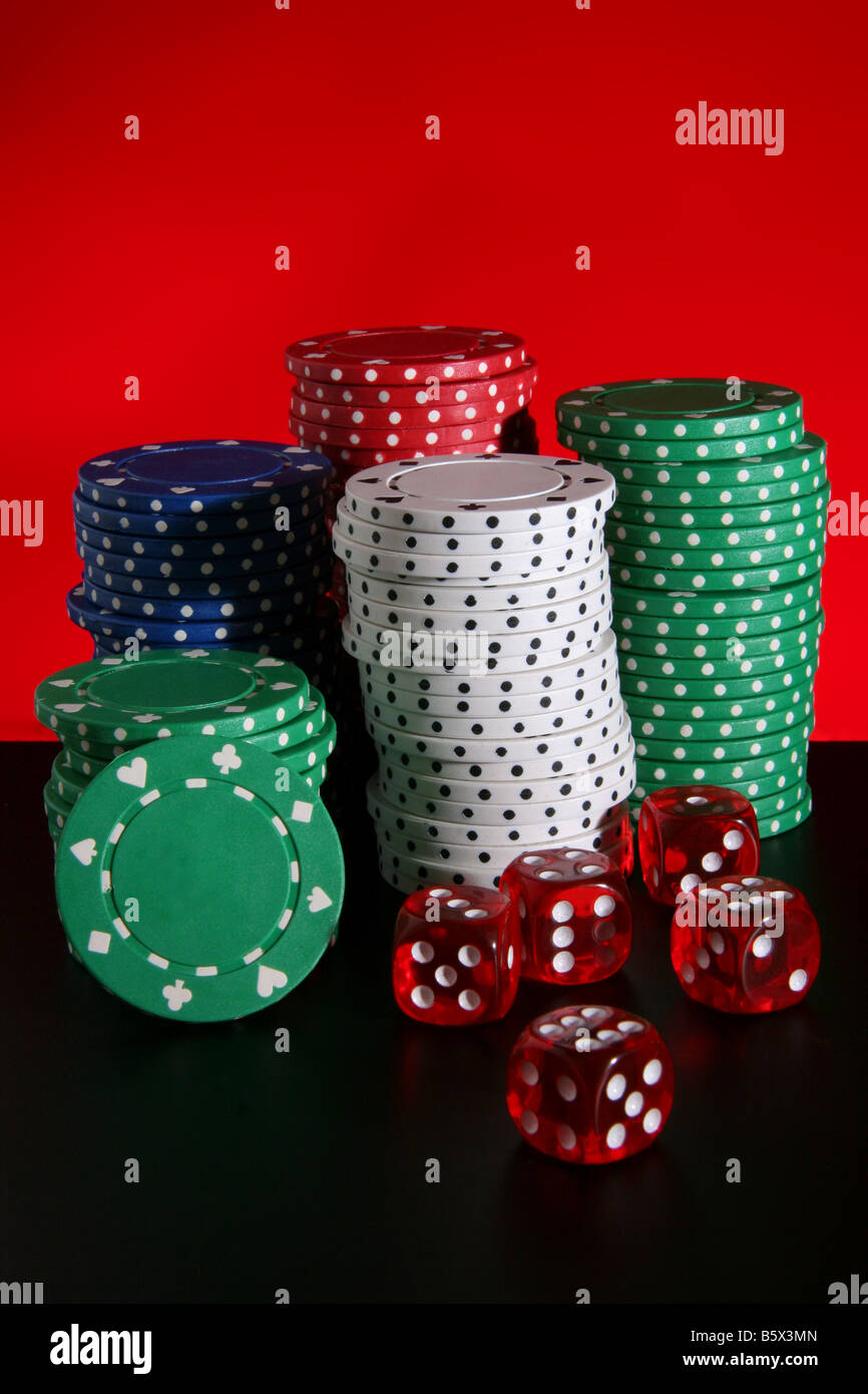 Piles of poker chips and dice Stock Photo Alamy