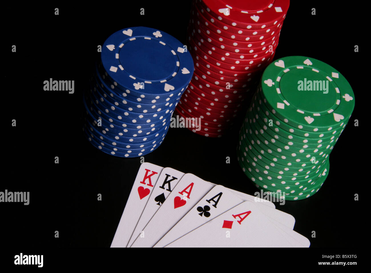 Piles of poker chips and playing cards Stock Photo Alamy