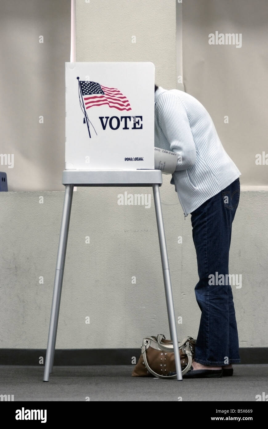 Elderly woman marking her ballot at a Polling Place in San Jose, CA, on November 4, during the 2008 U.S. Presidential election. Stock Photo